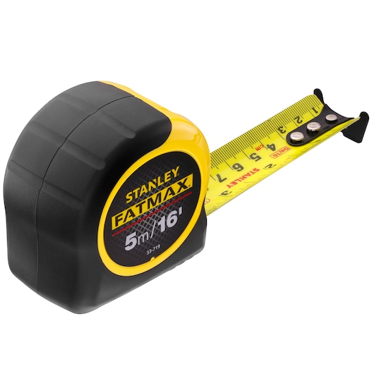 STANLEY 0-33-719 tape measure, black and yellow casing, extended yellow blade, FatMax 5m/16ft, angle on white background.