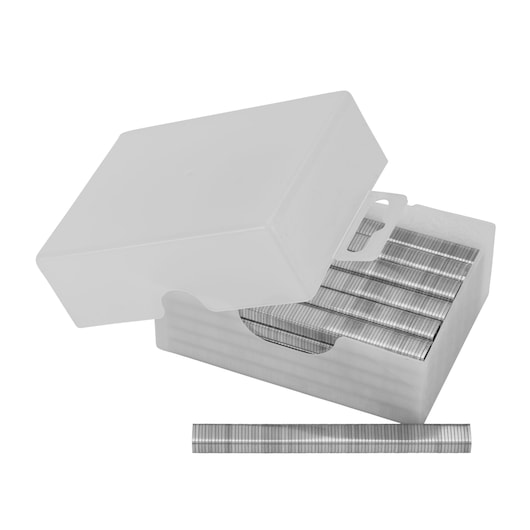 Box of silver staples with lid open, showing rows of staples and one row placed outside in front.