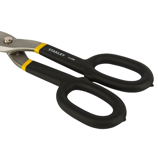 STANLEY 2-14-556 snips with black and yellow ergonomic handles, side angle on white background.