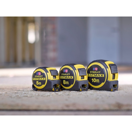 STANLEY FMHT0-36337 tape measures in 5m, 8m, and 10m sizes, yellow and black, shown side by side.