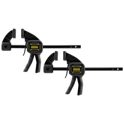 Two STANLEY trigger clamps for secure holding, black with yellow logo, suitable for woodworking or photography work.