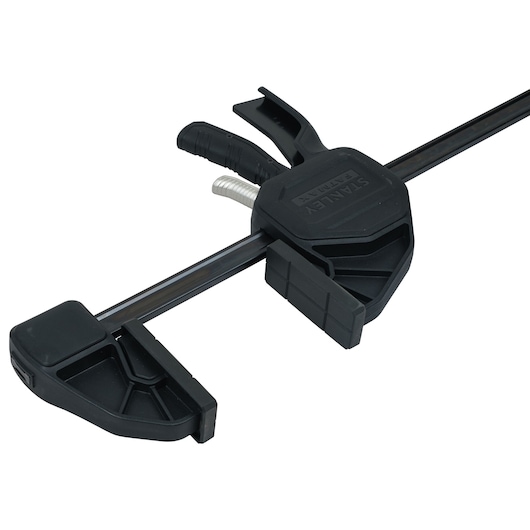 Stanley FMHT0-83242 bar clamp with black plastic jaws, side angle on white background.