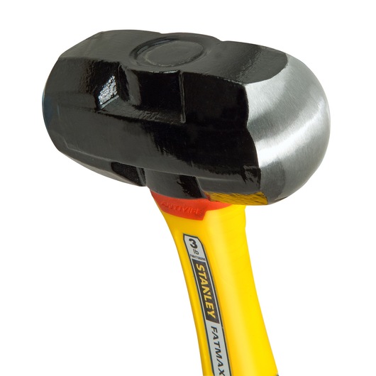 Stanley FatMax hammer with black head and yellow anti-vibe handle, close-up view of tool.