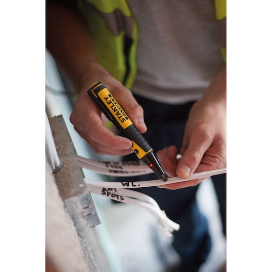 Photo of STANLEY FMHT82567-0 voltage tester used on labeled electrical cables.