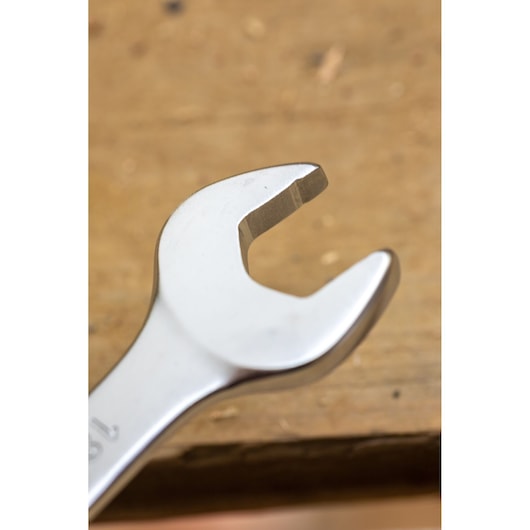 STANLEY FMMT13038-0 open-end wrench close-up, silver finish, tool photographed on wooden surface.