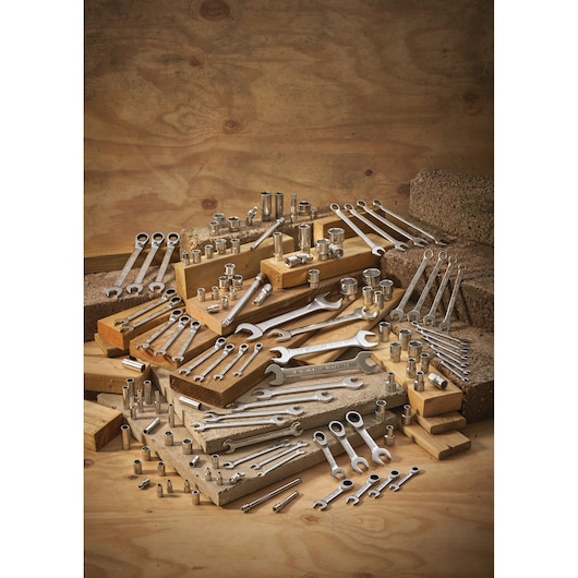 STANLEY FMMT13040-0 assorted wrenches and sockets displayed on wooden blocks, product photography.
