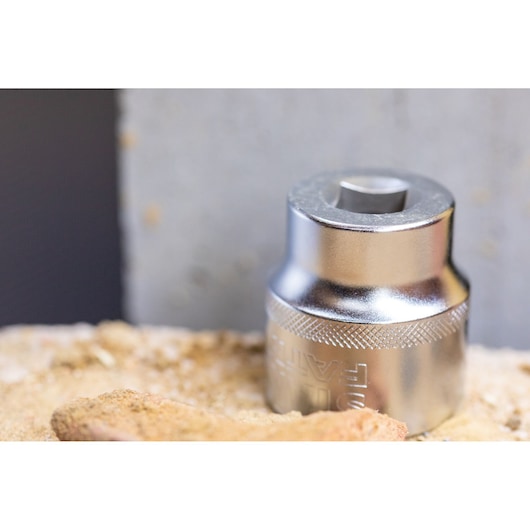STANLEY FMMT82685-1 chrome socket, close-up photo, shown on rough surface, tool accessory category.