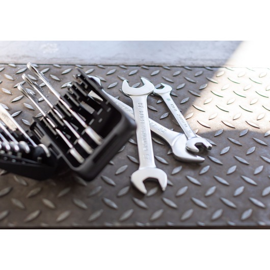 STANLEY FMMT82901-0 wrench set and open-end wrenches on textured metal surface, side angle.