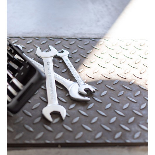 STANLEY FMMT82901-0 wrenches set on diamond plate floor, angled view, partial toolbox visible.