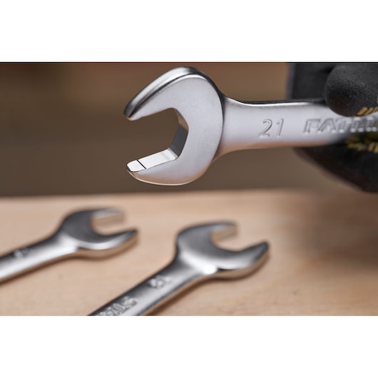 STANLEY FMMT82902-0 open-end wrench close-up with two wrenches on wood surface, photography