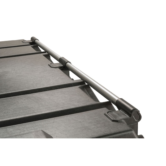 Close-up of a sturdy black plastic toolbox lid with a silver metal handle attached.