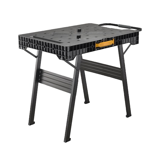 Black foldable workbench with a handle and yellow accent, suitable for photography or workshop use.