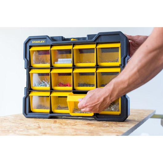 STANLEY FMST81077-1 organizer with yellow drawers for hardware, photography on tabletop.