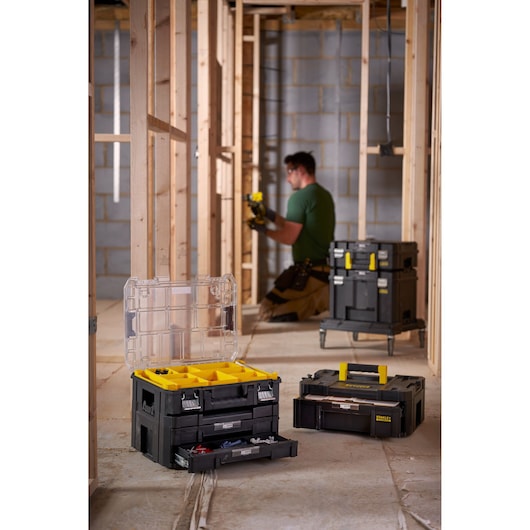 STANLEY FMST82967-9 modular black and yellow toolboxes with drawers in a construction setting.