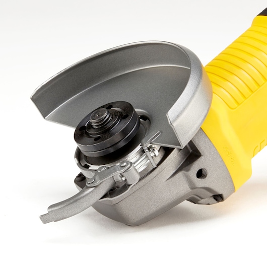 STANLEY KFFMEG220 angle grinder close-up on white background, showing guard and spindle.