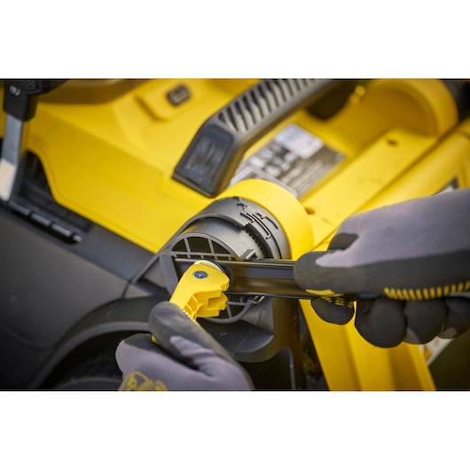 STANLEY SCMWP3701M2 lawn mower wheel adjustment close-up photography.