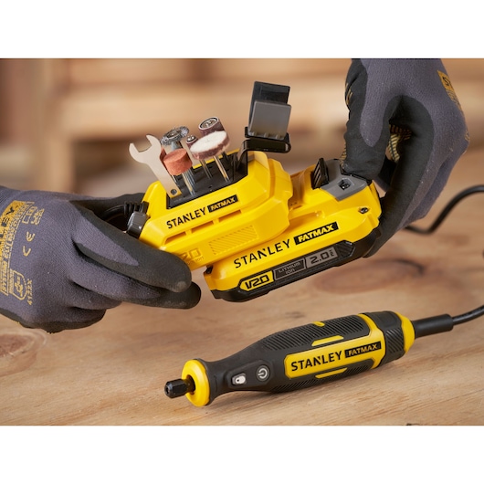 STANLEY SFMCE030B rotary tool kit with accessories, close-up on workspace, photo from above.