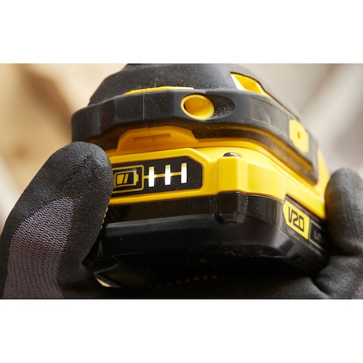 STANLEY SFMCF820D2K V20 power tool battery with charge indicator close-up, photography.