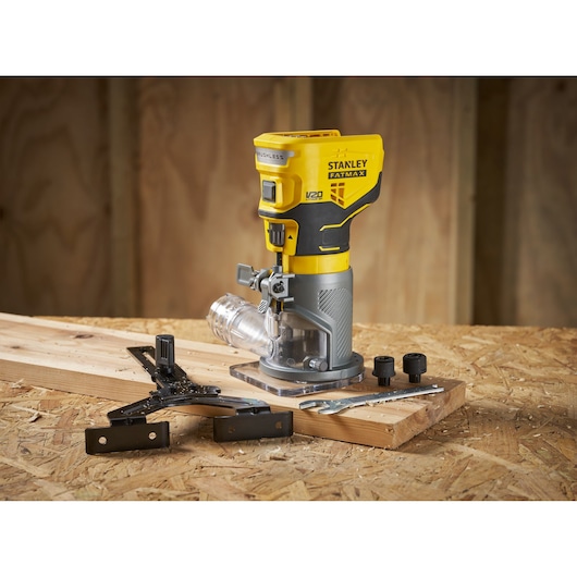 STANLEY SFMCW400B cordless router on wood with accessories, photo shows tool angled left.