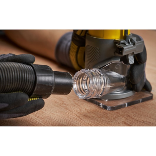 STANLEY SFMCW400B compact router with dust extraction port, close-up showing hose attachment setup.