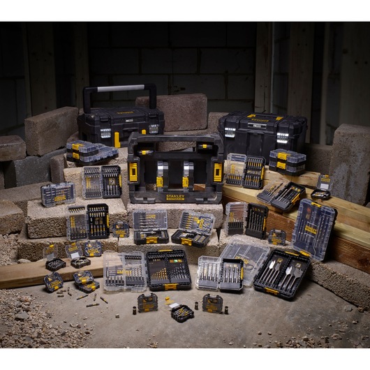 STANLEY STA88560 drill and bit set photography with multiple cases and tools on construction site.