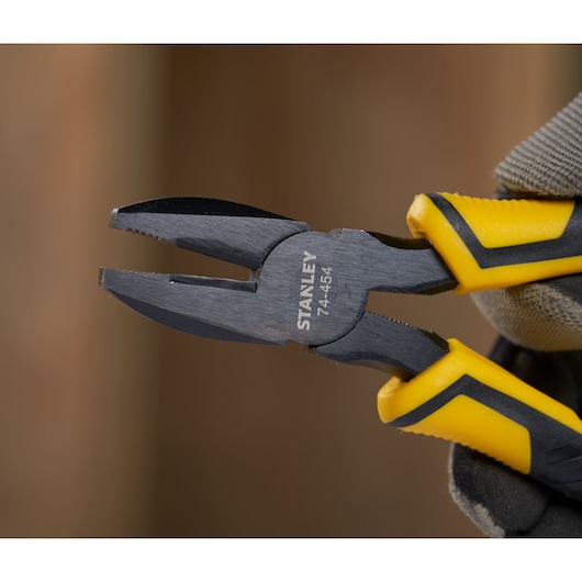 STANLEY STHT0-74456 pliers with yellow and black handles, close-up angle, photography product category.