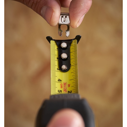 STANLEY STHT37236 tape measure close-up with detachable hook, yellow blade, black case.