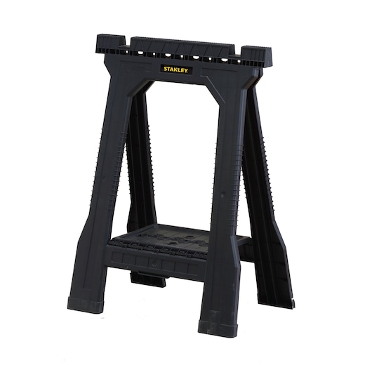 Black STANLEY folding sawhorse with sturdy plastic design for supporting materials during work.