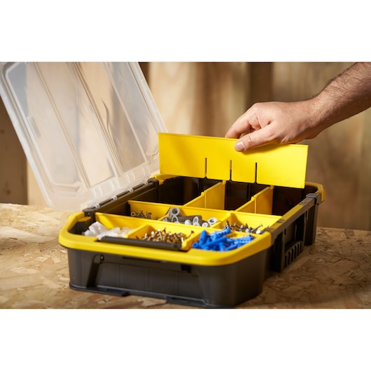 STANLEY STST1-71983 organizer box with clear lid and yellow dividers, filled with screws and hardware.