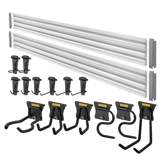 STANLEY STST22000-1 wall-mounted storage rail system set with silver rails and assorted black utility hooks, angled front view.