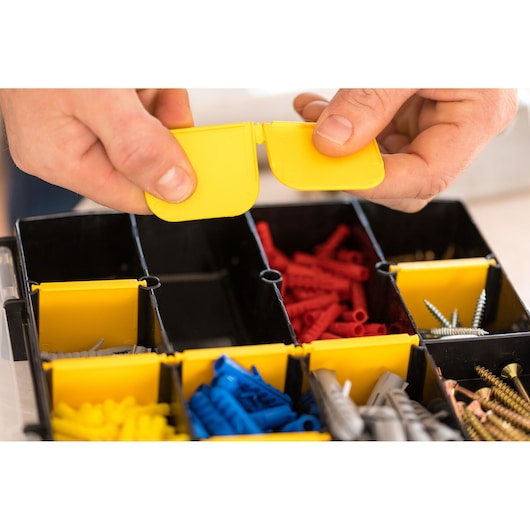 STANLEY STST81681-1 organizer box photography, yellow compartment lids, assorted screws and wall plugs.