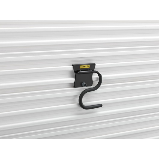 STANLEY STST82605-1 black wall hook mounted on white panel, product side angle.