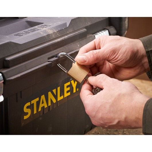 STANLEY STST82976-1 toolbox with lock being secured, close-up photography.