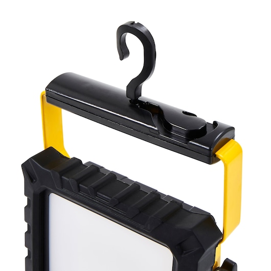 STANLEY SXLS31329E work light front angle with yellow frame and black hanging hook.