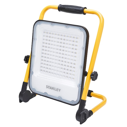 Photo of STANLEY SXLS37179E LED work light with yellow frame, front angle, on white background.