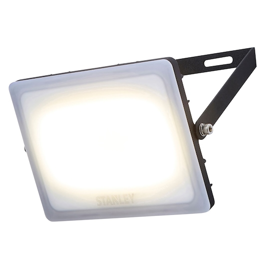 Stanley SXLS38930E LED floodlight, photography of front angle, black frame, white illuminated panel.