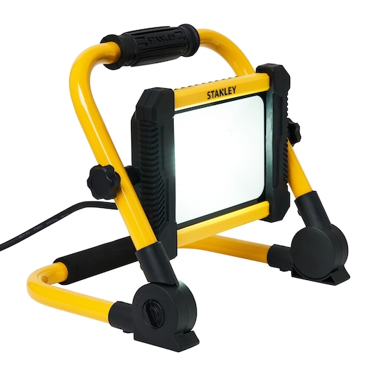 STANLEY SXLS41220E LED work light with yellow frame, black handle, and adjustable stand, front angle on white background.