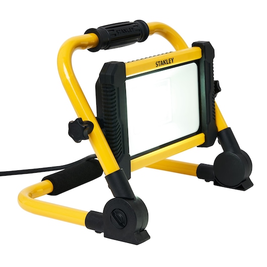 STANLEY SXLS41221E work light with yellow frame, black handle, and adjustable stand, angled front view on white.