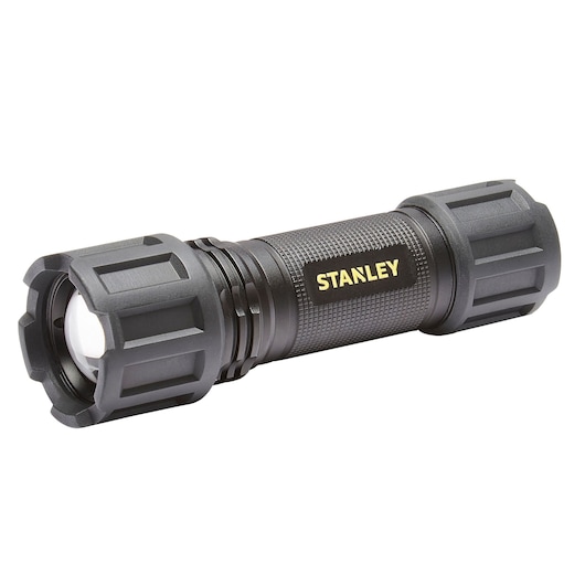 STANLEY SXLS50102E black rugged flashlight, angled side view, with textured grip and yellow STANLEY branding.