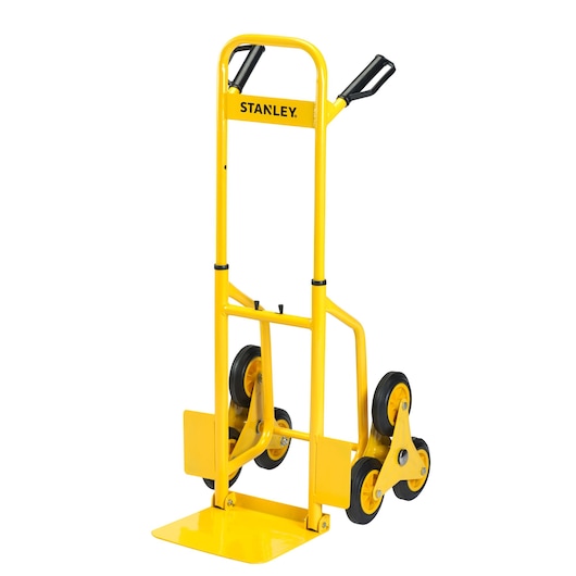 Yellow STANLEY stair-climbing trolley with tri-wheel design, metal frame, and foldable base for easy transport.